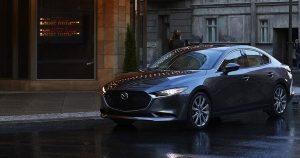 A silver 2019 Mazda3 sedan parked on the street in Wichita, KS