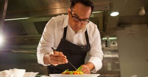 A chef preparing a gourmet meal at a fine dining spot in Wichita, KS